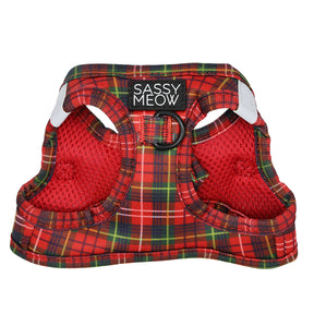 The Cat Step-In Harness - Deck the Paws by Sassy Woof features a red plaid design, breathable mesh, reinforced edges, dual leg openings, a black D-ring for leashes, and an AirTag pocket—ideal for holiday cat style.
