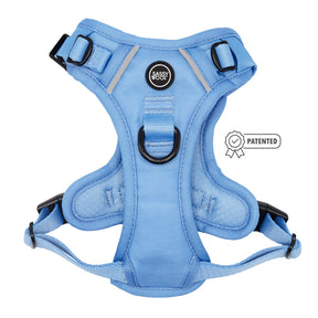 The Sassy Woof Dog Step-in Harness - Hydrangea is a pastel blue harness with black buckles, metal rings, a center chest Sassy Woof label, and includes a small patented badge next to the harness.
