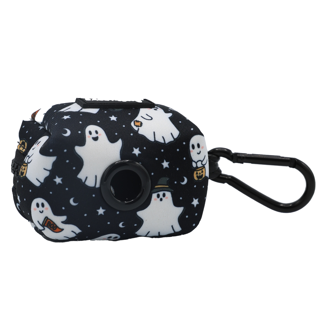 The Sassy Woof Dog Waste Bag Holder - Lil Boo Thing features a black dispenser with a convenient clip, adorned with white cartoon ghosts, stars, and moons on a dark background—perfect for pairing with your favorite Halloween dog accessories or matching your pup’s ghost dog harness.
