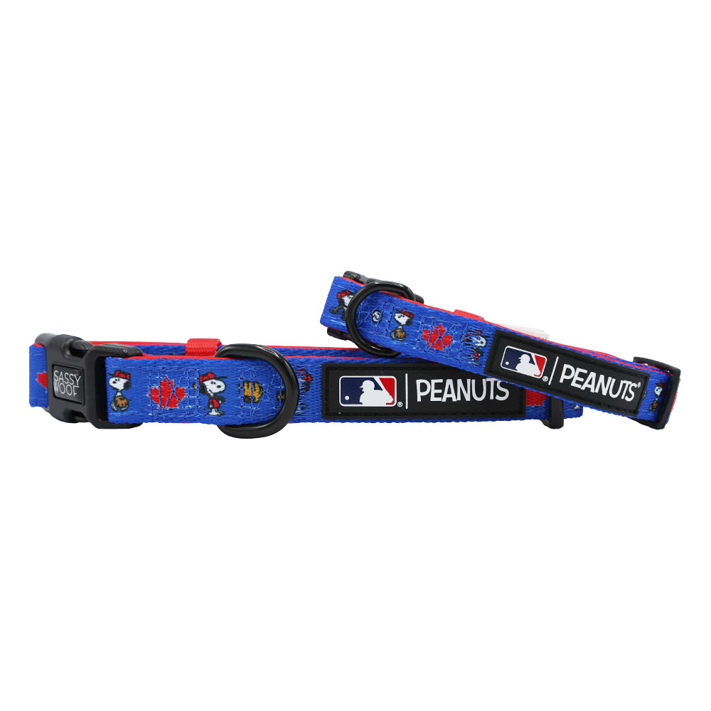 The Sassy Woof Dog Collar - MLB™ x Peanuts™ Toronto Blue Jays™ features blue adjustable collars with Snoopy, cartoon designs, red maple leaf, and MLB logo patches. Includes black plastic buckles and sturdy metal rings.