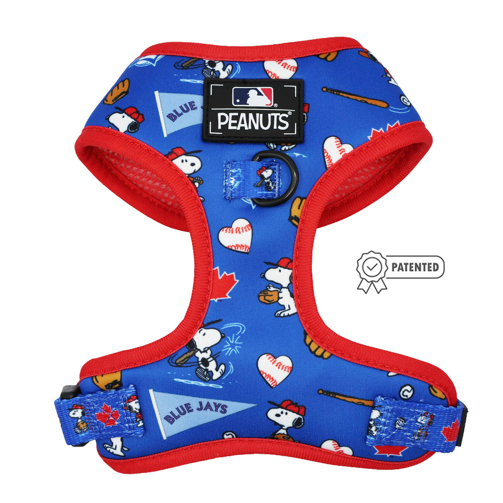The Sassy Woof Dog Two Piece Bundle - MLB™ x Peanuts™ Toronto Blue Jays™ harness features Snoopy in baseball poses, Blue Jays logos, bats, and baseballs, with Peanuts and MLB logos on the chest and a Patented badge on the right.