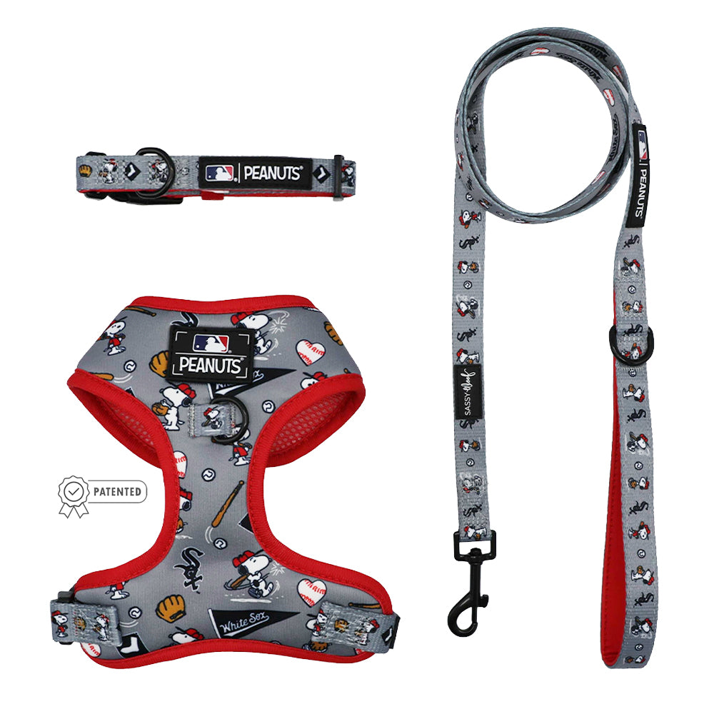 The Sassy Woof Harness Three Piece Bundle - MLB™ x Peanuts™ Chicago White Sox™ features gray gear with red trim and fun Snoopy, Woodstock, bats, gloves, and logos—plus PEANUTS labels—ideal for your puppy's growth.
