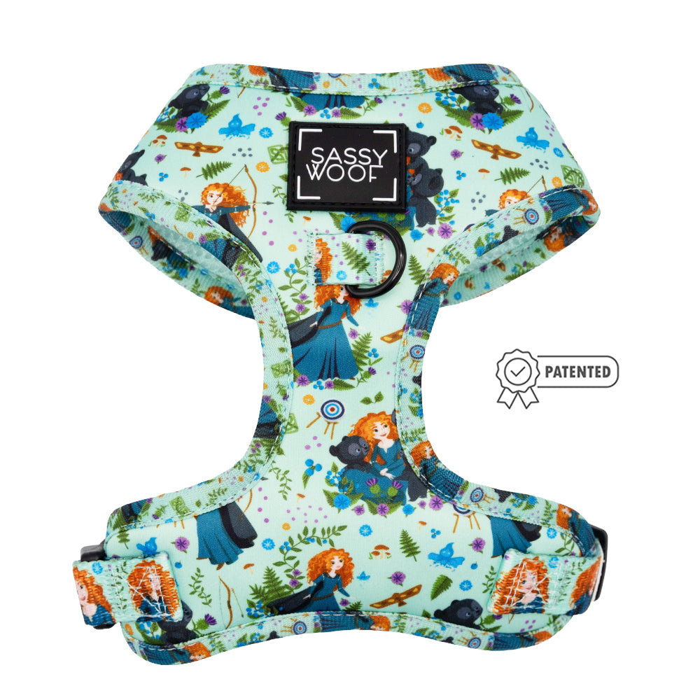 The Sassy Woof Dog Adjustable Harness - Disney's Merida features turquoise fabric with a Merida-inspired print, adjustable straps, a D-ring, and a patented icon for style and comfort.