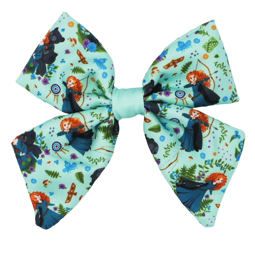 The Dog Sailor Bow - Disney's Merida by Sassy Woof is a light blue hair bow featuring Merida, a black bear, archery targets, arrows, and plants—a whimsical Disney Brave accessory for your pup.