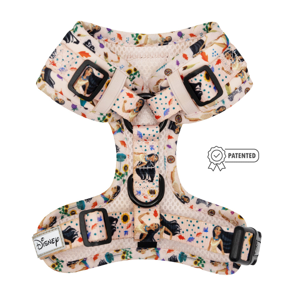 The Sassy Woof Dog Adjustable Harness - Disney's Pocahontas features a playful character print, black buckles, Disney label, small Patented badge, and is part of the Puppy Growth Pawtection Plan for growing pups.