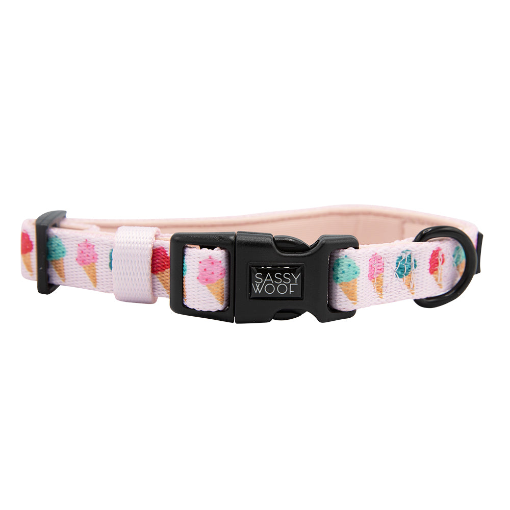 The Sassy Woof Dog Collar - A Sprinkle of Sass features a pink design with colorful ice cream cones, an adjustable fit, branded black buckle, and sturdy metal ring—perfect for your puppy’s growth.