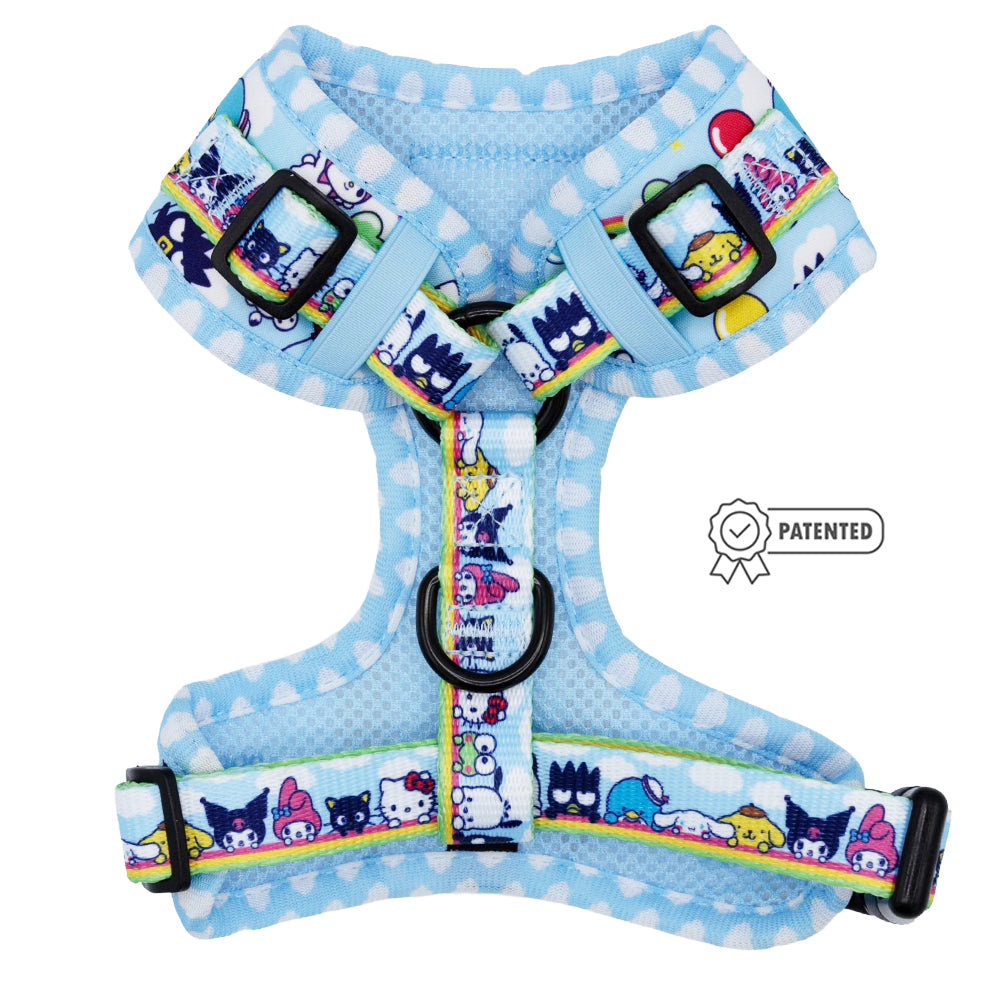 The Sassy Woof Dog Adjustable Harness - Hello Kitty® & Friends In the Sky features a light blue design with white polka dots, colorful cartoon characters on the straps, and a patented badge highlighting this playful Sanrio collaboration.