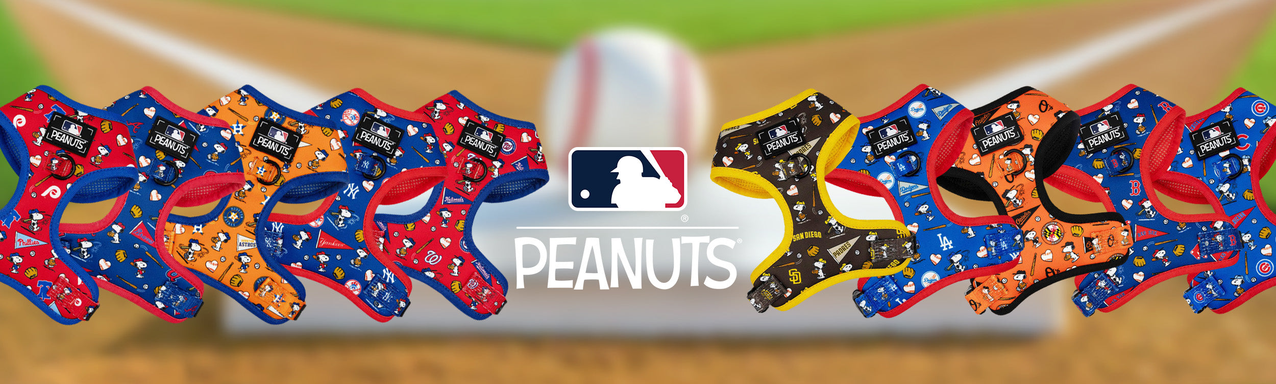 Peanuts-themed baseball cleats with MLB logo on a baseball field background