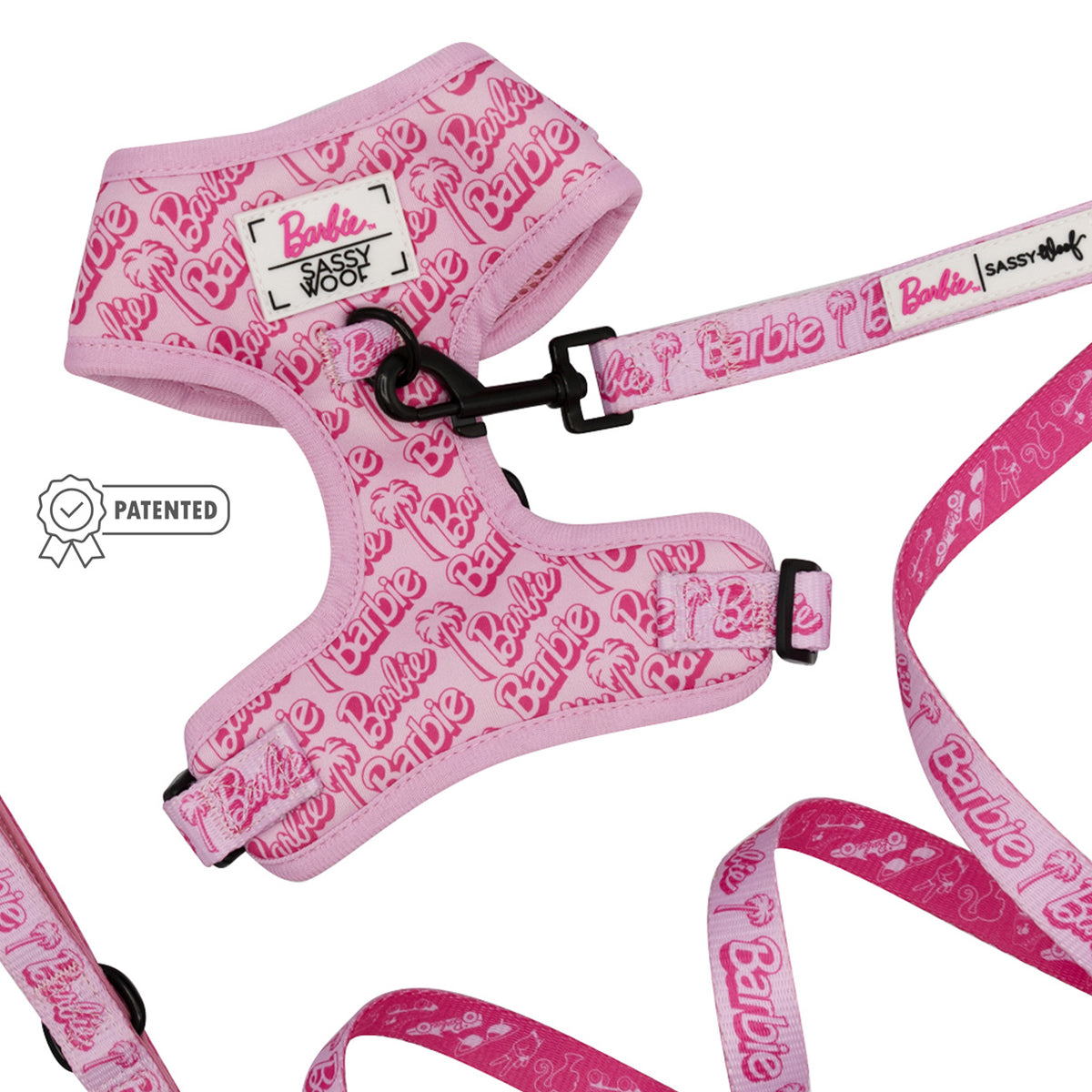 A pink adjustable harness with a leash from the Sassy Woof Dog Two Piece Bundle - BARBIE™ Malibu collection.
