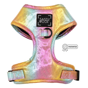 The Sassy Woof Dog Adjustable Harness - The Night Life features a shiny, multicolored metallic rainbow pattern, a black center metal ring, “Sassy Woof” label, and a “Patented” badge icon.