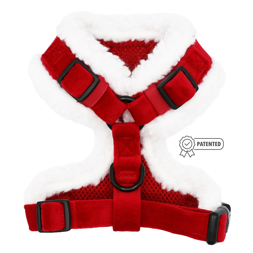 The Sassy Woof Dog Adjustable Harness - Naughty features red velvet, white faux fur trim, black buckle clips, mesh fabric, a patented badge icon on the right side, H-shape design—ideal as a holiday dog accessory.