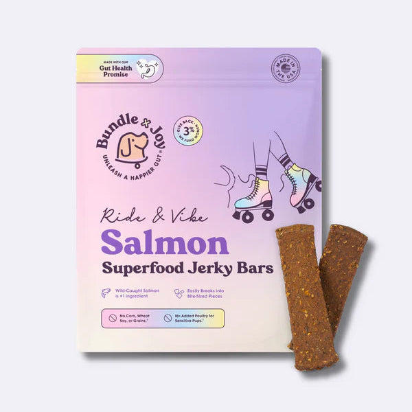 Sassy Woof Bundle x Joy Salmon Superfood Jerky Bars for dogs, with roller skate art and two bars beside the bag on a light background—perfect limited-ingredient treats your pup will love.