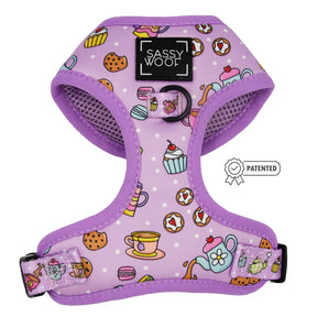The Sassy Woof Dog Adjustable Harness - Tea Pawty features a purple design with teapots, teacups, cupcakes, and cookies; includes logo on front and Patented badge; adjustable for comfort and puppy growth.