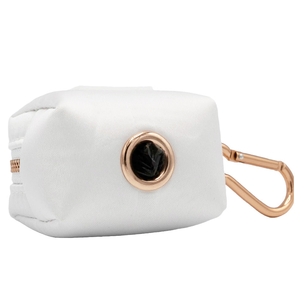 The Sassy Woof Dog Waste Bag Holder - Pup of Honor is a white satin holder with a rose gold zipper, matching carabiner, grommet for easy bag dispensing, and includes a roll of black bags.