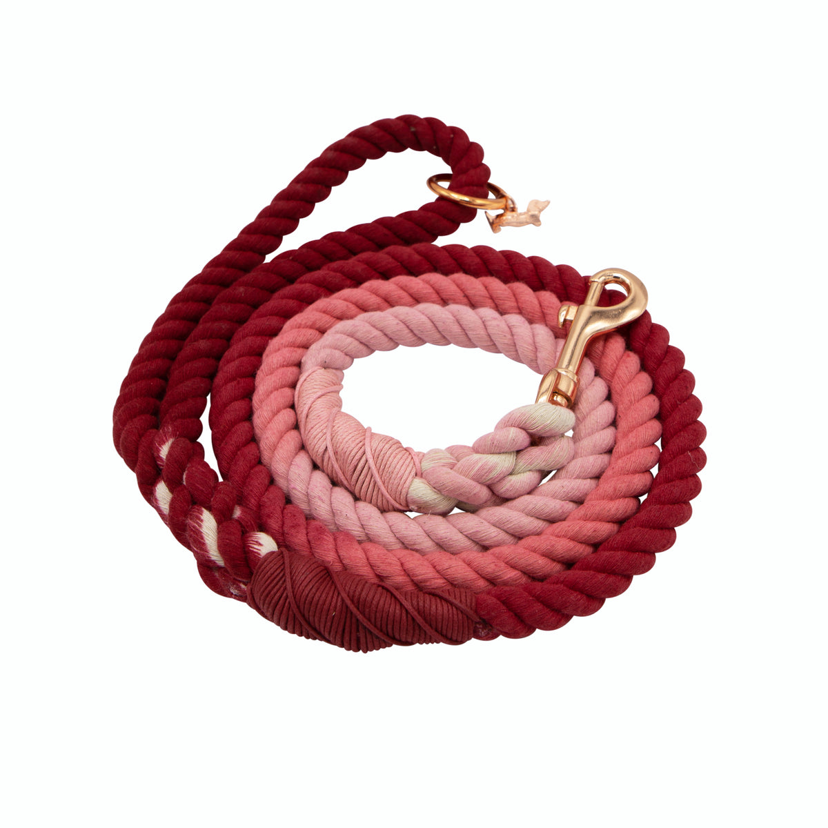 The Sassy Woof Dog Rope Leash - Beloved is a thick, coiled cotton leash with a gradient from dark red to light pink and rose gold hardware.