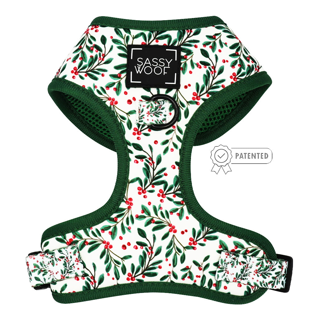 The Sassy Woof Dog Two Piece Bundle - Under the Mistletoe features a festive green and red berry leaf adjustable harness with dark green trim, a black Sassy Woof label, chest metal ring, side Patented badge—perfect to pair with your dog leash.