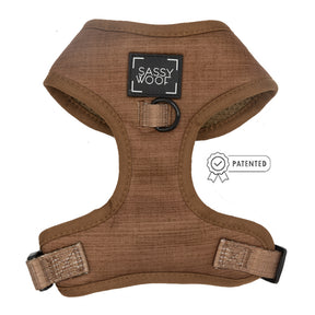 The Sassy Woof Dog Adjustable Harness - Teddy is brown with black buckles, a "Sassy Woof" front label, patented no-pull design, and a black metal D-ring on the chest.