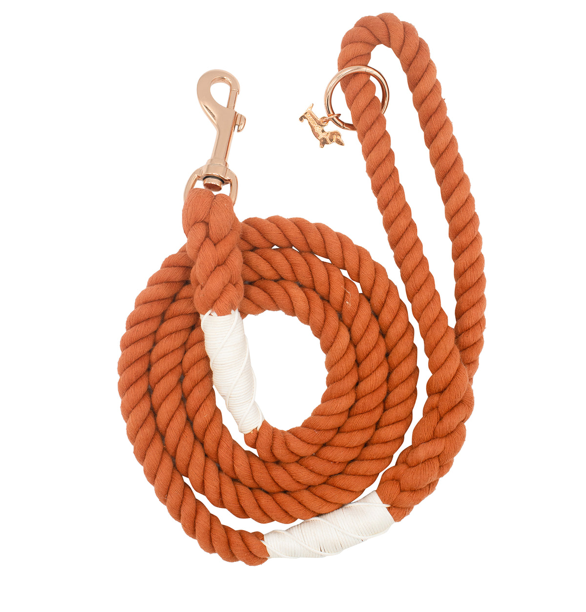 The Sassy Woof Dog Rope Leash - Athens is a coiled orange cotton leash with white accent wraps and a rose gold hardware clasp, neatly displayed on a white background.