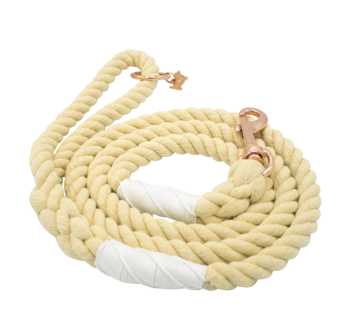 The Sassy Woof Dog Rope Leash - Dandelion is a coiled beige cotton leash with white-taped ends and a copper-colored metal clasp.