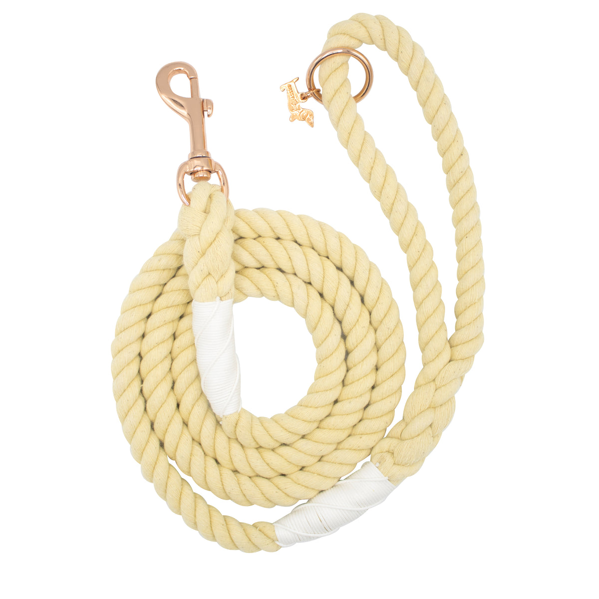 The Sassy Woof Dog Rope Leash - Dandelion is a coiled light yellow cotton leash with gold-tone clasp and ring, plus white bindings at both ends.