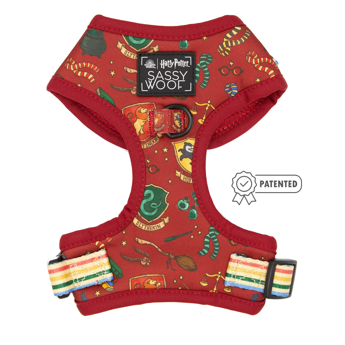 The Sassy Woof Dog Two Piece Bundle – Harry Potter™ features a red, adjustable harness with themed illustrations, house crests, and magical items—complete with Harry Potter and Sassy Woof labels for stylish pups.