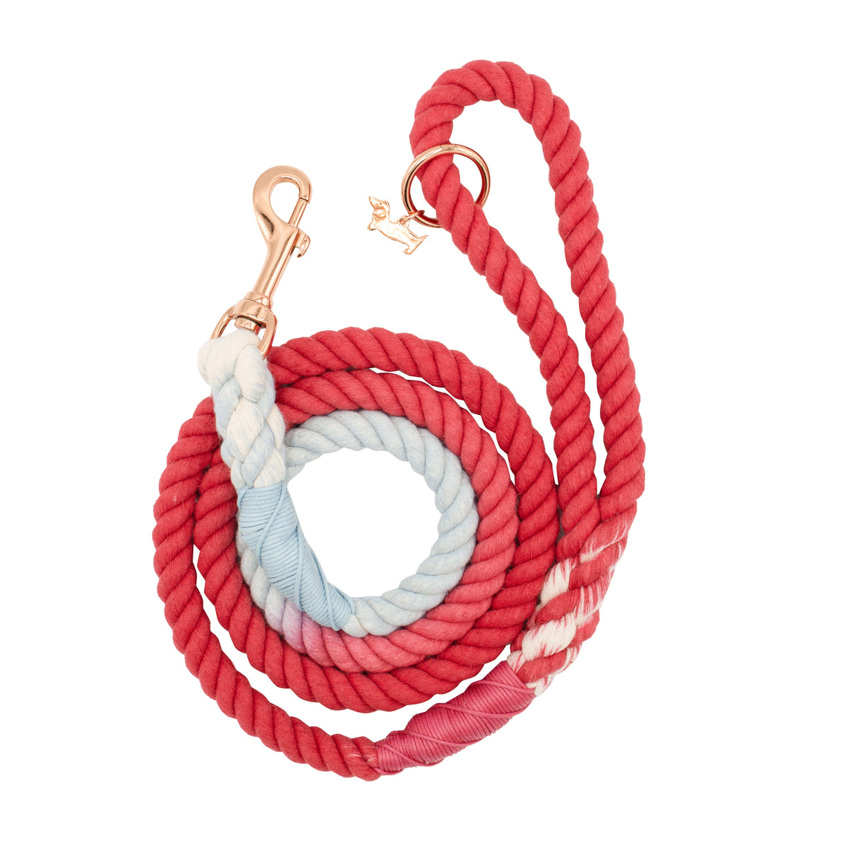 The Sassy Woof Dog Rope Leash - Watermelon Sugar is a hand-crafted red leash with ombre light blue and white twists, a coiled rope design, gold clasp, and a small gold dog-shaped charm near the clasp.