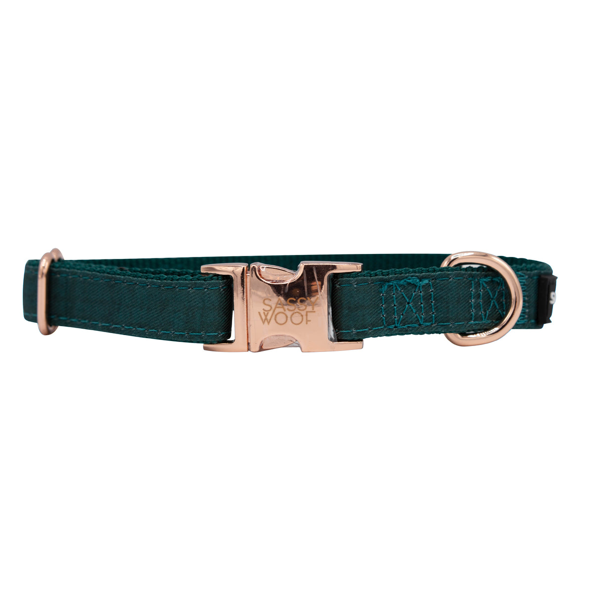 The Sassy Woof Dog Collar - Forest features a durable teal nylon design with gold hardware, an engraved metal buckle, and a D-ring for leash attachment—an adjustable, stylish choice for your pup’s everyday adventures.