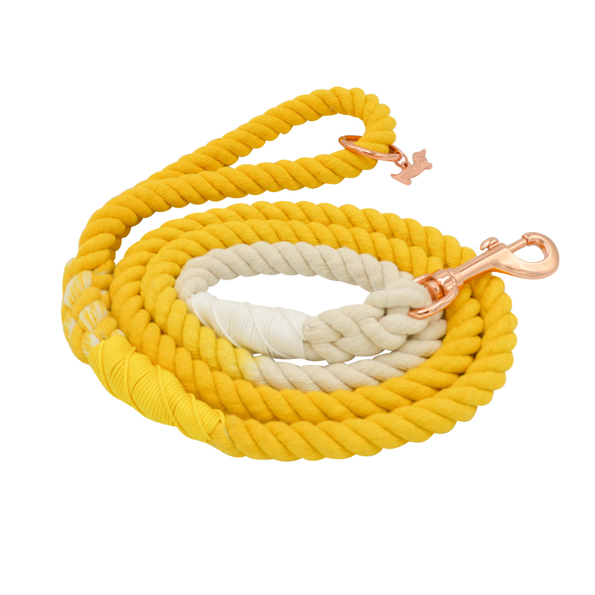 The Sassy Woof Dog Rope Leash - Lemon Drop is a hand-crafted, thick cotton leash in yellow, beige, and white ombre, with a rose gold clasp and a bone-shaped charm near the handle.