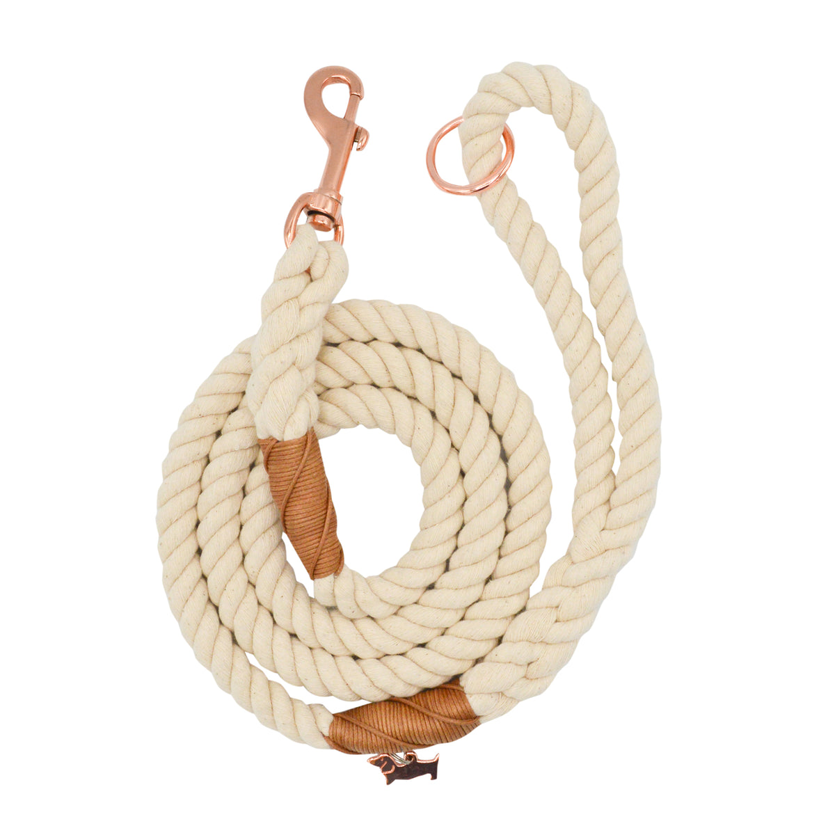 The Sassy Woof Dog Rope Leash - Natural features coiled cream cotton, brown leather accents, and rose gold hardware, shown on a white background.