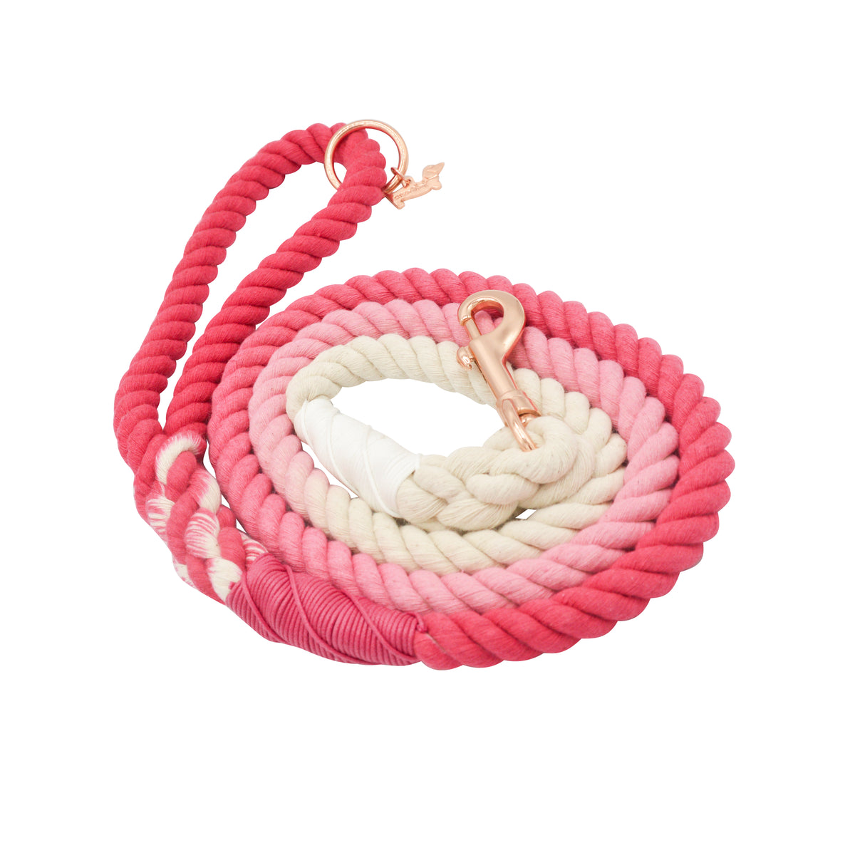 The Sassy Woof Dog Rope Leash - Ombre Pink features a thick, twisted design in pink-to-cream gradient, with a rose gold clasp and matching ring at the handle for added style and durability.