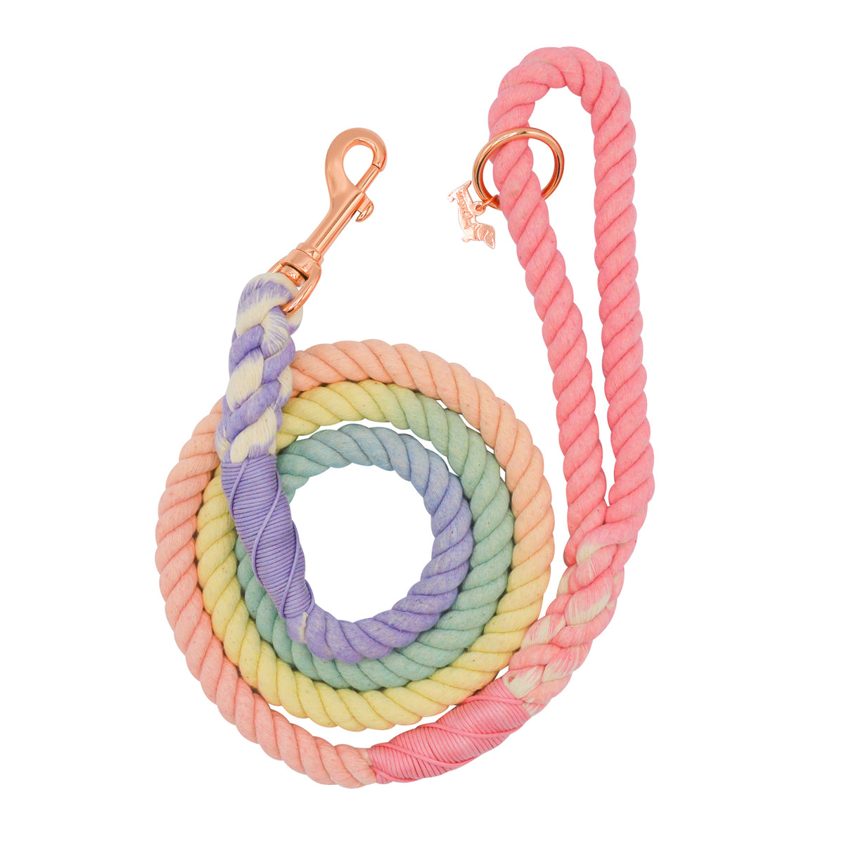 The Sassy Woof Dog Rope Leash - Rainbow Bright is a coiled cotton leash in pastel hues with a rose gold clasp and a convenient metal ring near the handle.