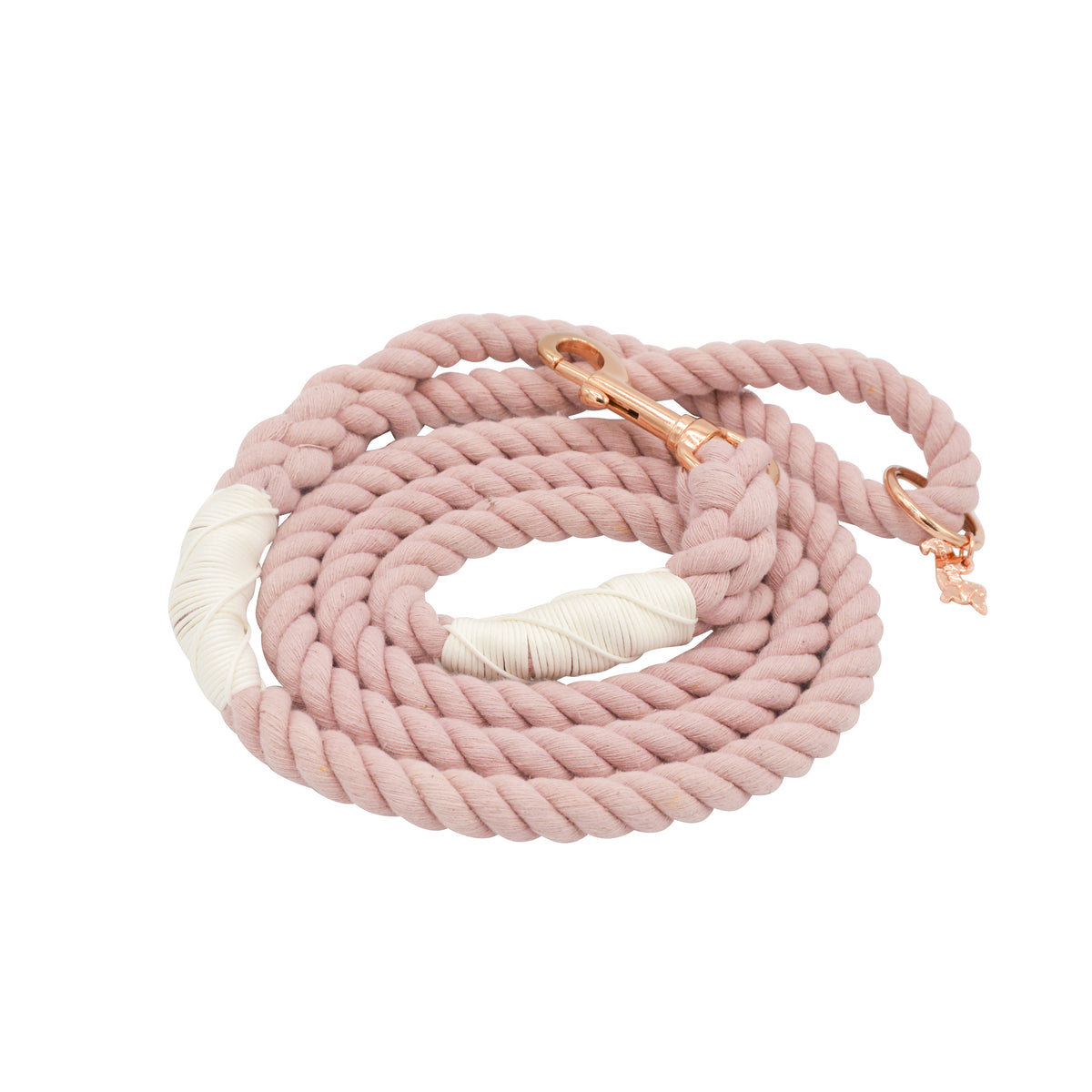 The Sassy Woof Dog Rope Leash - Rose All Day features a coiled pink cotton rope with white wrapping, rose gold hardware, and a sturdy metal clasp, shown on a white background.