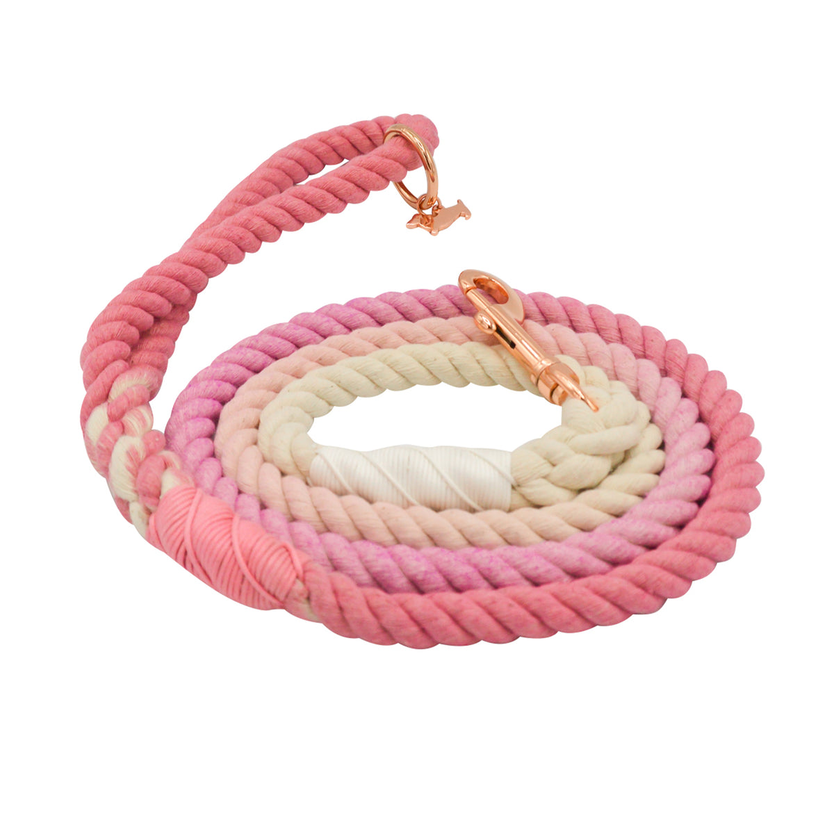 The Sassy Woof Dog Rope Leash - Rosie is a coiled cotton leash with a pink and cream ombre design, rose gold hardware, and pink decorative thread near the ends.