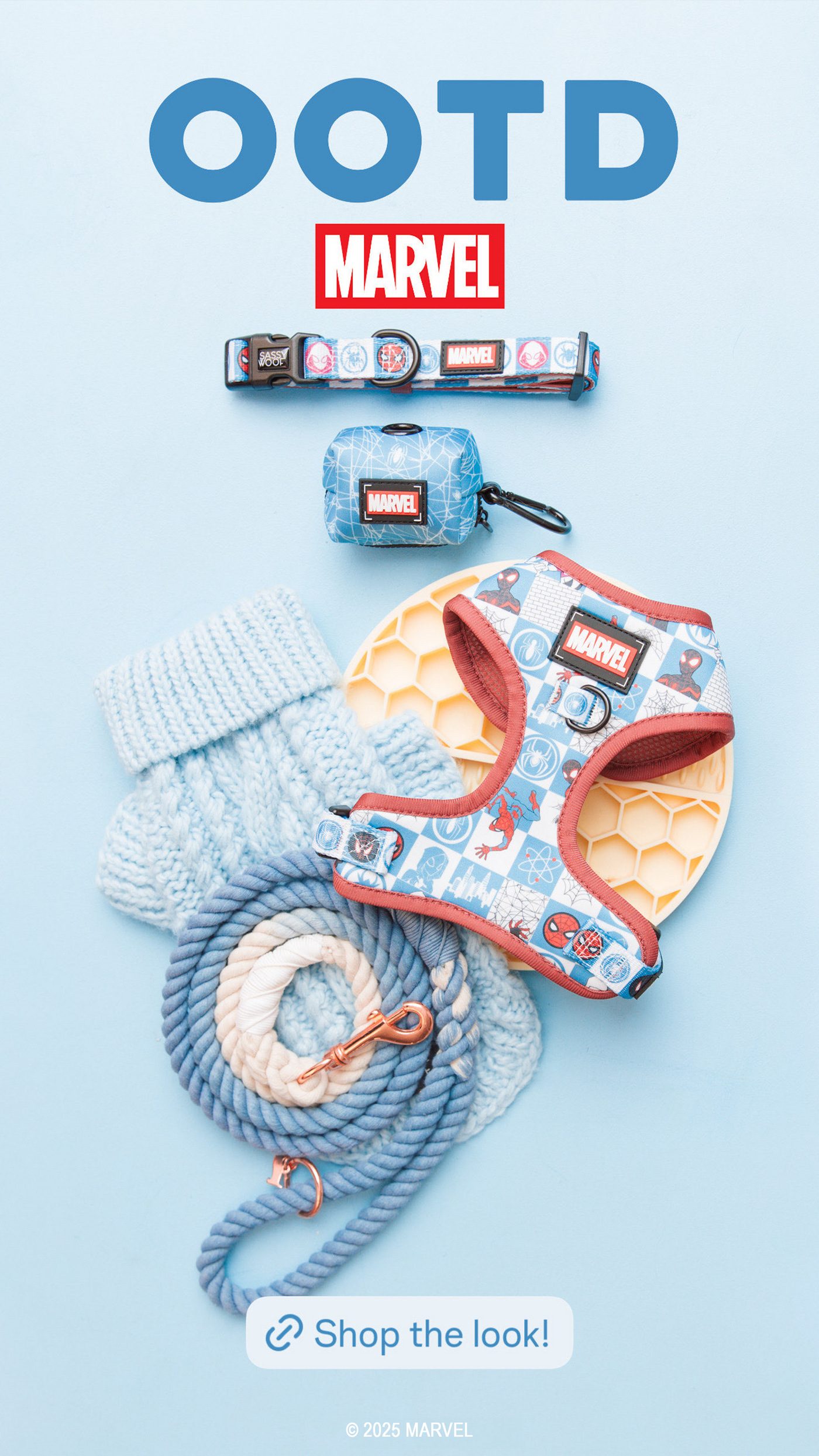Flat lay of Marvel-themed dog accessories on a light blue background, including a harness, leash, collar, waste bag holder, blue sweater, and a yellow chew toy. Text reads OOTD and Shop the look!.