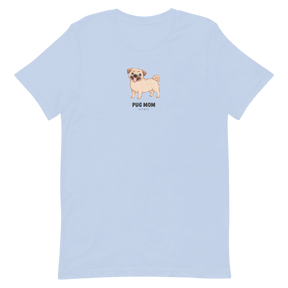 The Pug Mom Tee by Sassy Woof is a light blue unisex shirt with a cartoon smiling pug and bold "Pug Mom" text centered on the chest—perfect for proud pug lovers.