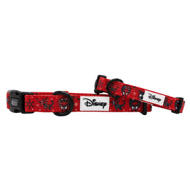 Two red Sassy Woof Dog Collar - The Nightmare Before Christmas™ lay flat and propped diagonally, featuring black buckles and rings, plus black-and-white character designs with snowflakes.