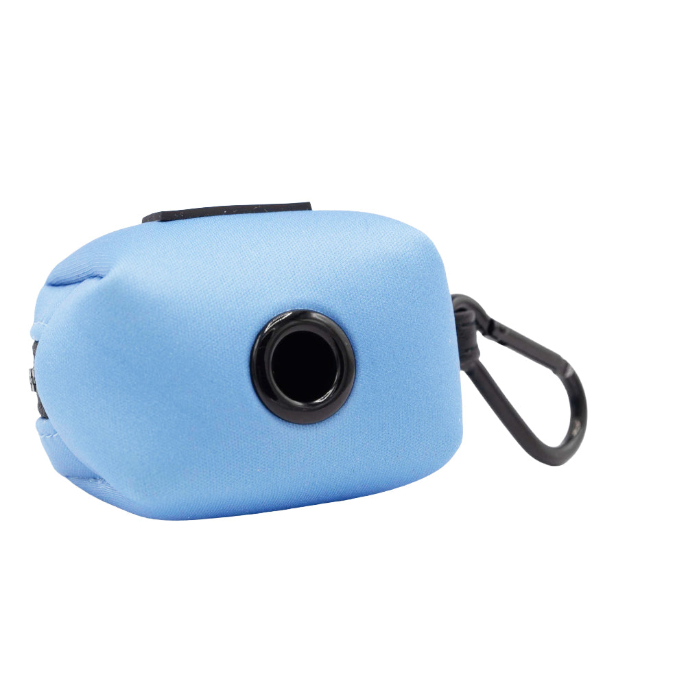 The Sassy Woof Dog Waste Bag Holder - Hydrangea is a light blue rectangular pouch with a black circular dispenser on the front and a black plastic clip. Ideal for pastel pet accessory lovers.