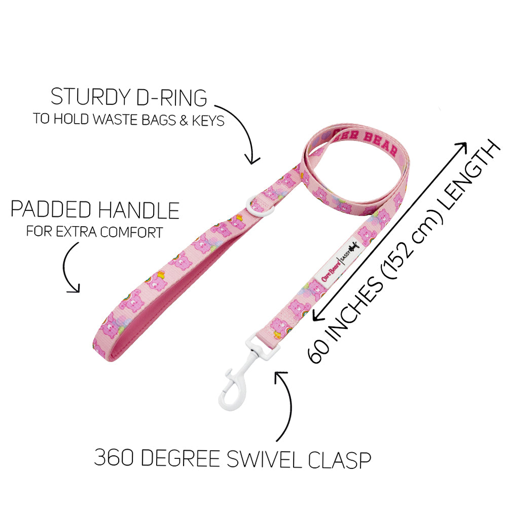 The Sassy Woof Dog Four Piece Bundle - Care Bears™ Cheer Bear includes a pink leash with cartoon bears, padded handle, sturdy D-ring, 60" (152 cm) length, 360° swivel clasp, and text highlighting features around the leash.