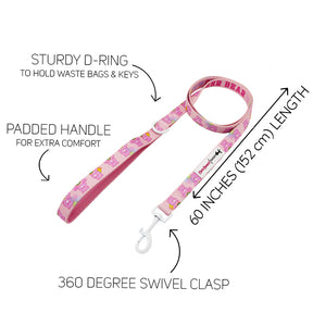 The Sassy Woof Dog Leash - Care Bears™ Cheer Bear is a pink leash with cartoon bears, a sturdy D-ring for keys or bags, padded handle, 60-inch (152 cm) length, and 360° swivel clasp.