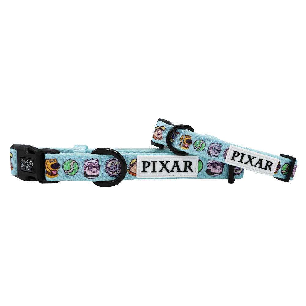 The Dog Collar - Disney and Pixar's Up by Sassy Woof features a light blue design with Pixar characters and icons, a Pixar logo tag, black plastic buckle, adjustable strap, and pairs perfectly with your favorite Disney dog harness.