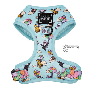 The Sassy Woof Dog Two Piece Bundle - Disney and Pixar's Up is a light blue adjustable harness with cartoon dogs floating with balloons, inspired by Pixar. It features a black Sassy Woof label on the front and a patented icon on the right.