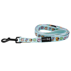 The Sassy Woof Dog Leash - Disney and Pixar's Up features a light blue design with cartoon dogs and tennis balls, a black clip, and a black Sassy Woof label.