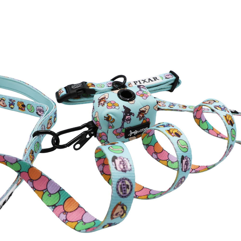 The Sassy Woof Collar Three Piece Bundle - Disney and Pixar's Up features a light blue dog harness, leash, and collar with colorful Pixar balloon and character designs, shown against a white background.