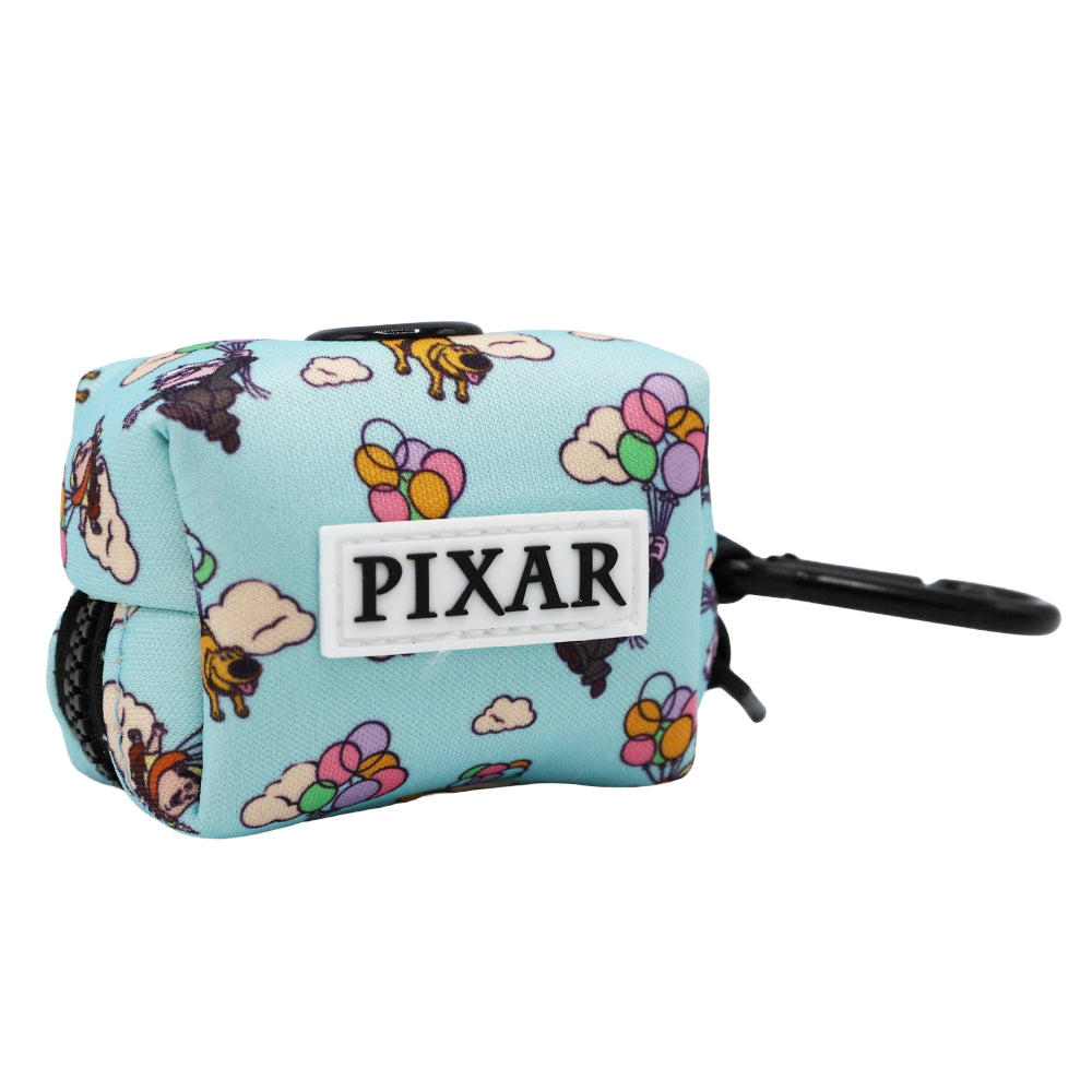 The Sassy Woof Dog Waste Bag Holder – Disney and Pixar's Up features a light blue pouch with balloons, clouds, and a house, a white PIXAR patch on the front, and a black clip—perfect for fans of Up dog accessories.