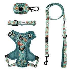 The Sassy Woof Dog Four Piece Bundle - Disney’s The Lion King Wild Kingdom includes a harness, leash, collar, and waste bag holder featuring vibrant Lion King characters and tropical plants—an essential set for any Disney pet collection.
