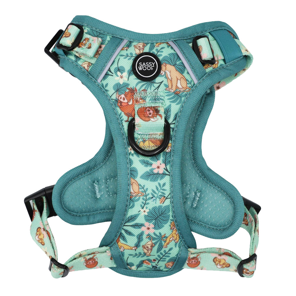 Teal and light blue padded Sassy Woof dog harness from the Disney’s The Lion King Wild Kingdom collection, featuring playful animal illustrations. Includes adjustable straps, black buckles, and a Sassy Woof logo on the chest—ideal for fans of The Lion King!.