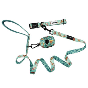 Introducing the Sassy Woof Dog Collar Three Piece Bundle – Disney’s The Lion King Wild Kingdom: a light blue Disney-themed set featuring a collar, leash, and poop bag holder, each adorned with green leaf patterns and beloved Lion King character illustrations. This unique trio is the perfect choice for fans seeking distinctive Disney dog accessories.