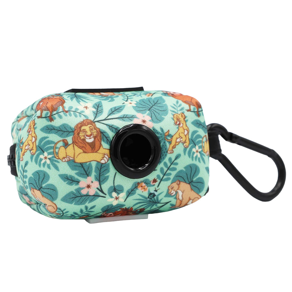 A teal bag dispenser from the Sassy Woof Dog Four Piece Bundle - Disney’s The Lion King Wild Kingdom, featuring a floral pattern with cartoon lions, a black plastic clip, and a round opening for dispensing bags.