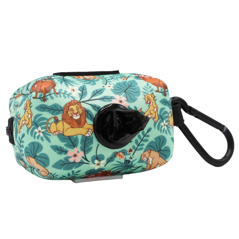 The Sassy Woof Dog Waste Bag Holder - Disney’s The Lion King Wild Kingdom is a small, teal holder featuring a playful cartoon jungle animals print. Designed with a black dispenser opening and a black clip for attaching to your leash, it’s the perfect companion to your favorite Lion King dog harness.