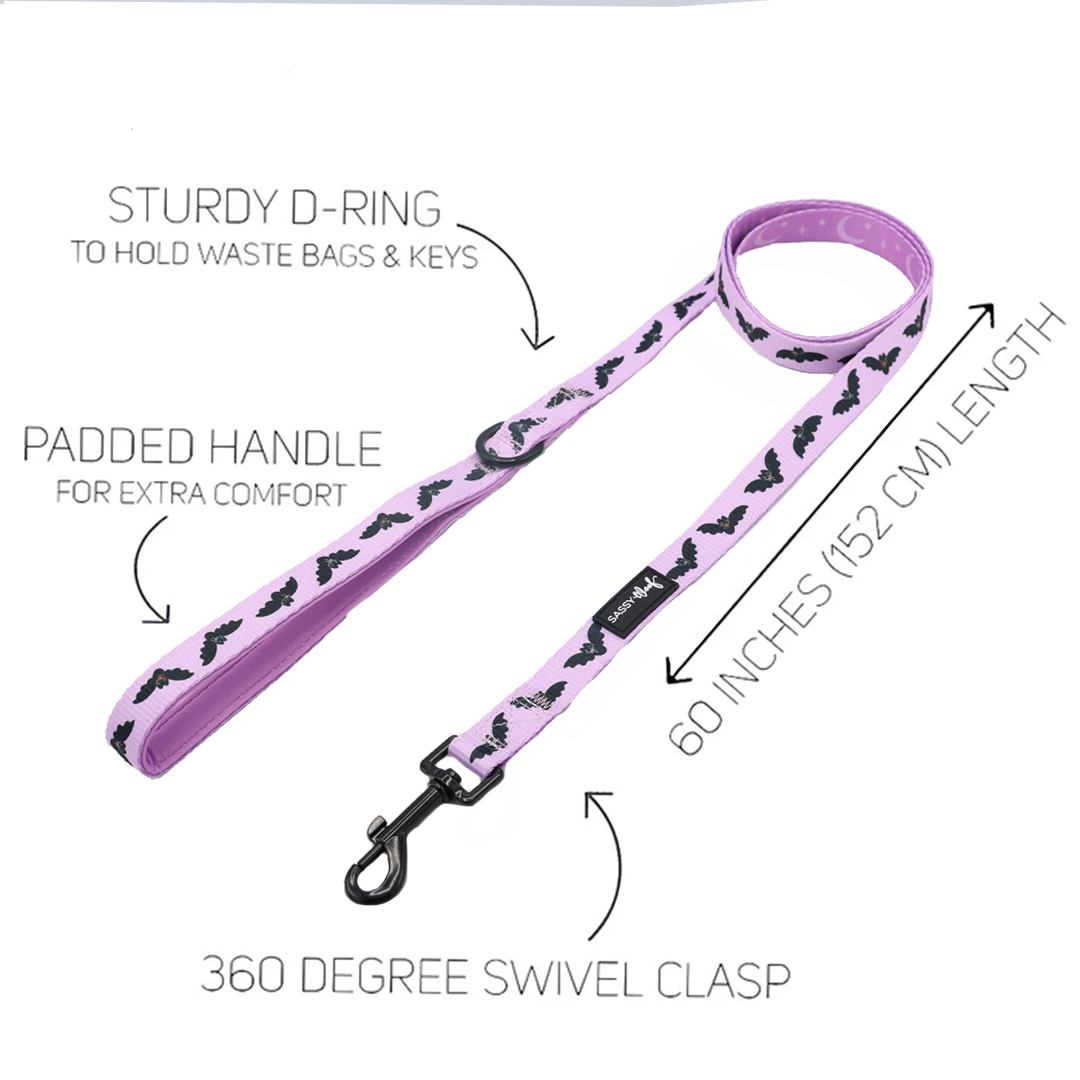 Part of the Dog Four Piece Bundle - Lil Batty by Sassy Woof, this pink dog leash features a bold black bat pattern, padded handle for comfort, sturdy D-ring for attaching waste bags or keys, a 60-inch (152 cm) length, and a 360-degree swivel clasp—ideal for pairing with your favorite adjustable dog harness.